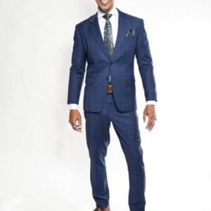 Man in blue suit smiling on white background.