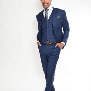 Man in blue suit with tie smiling.